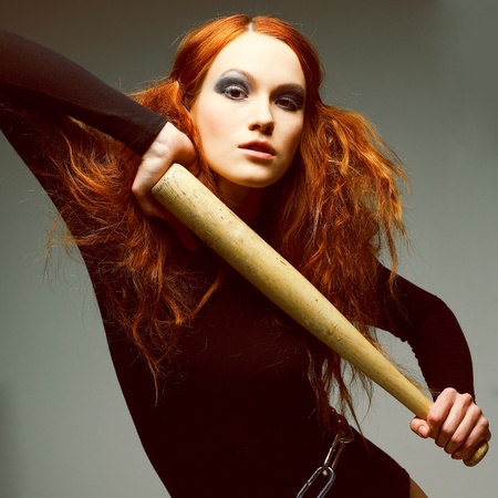 A beautiful young woman is in dark  clothesの写真素材