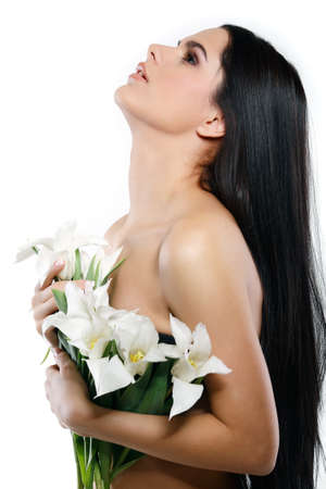 beautiful young girl with tulips,isolated on a white backgroundの写真素材