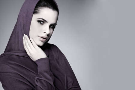 A beautiful young woman is in red clothesの写真素材