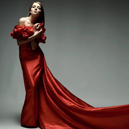 A beautiful young woman is in red clothesの写真素材