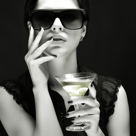 beautiful young girl  with  glass of martiniの写真素材