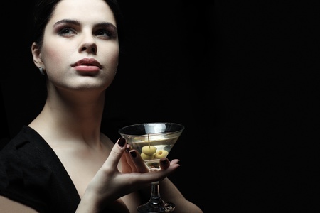 beautiful young girl  with  glass of martiniの写真素材