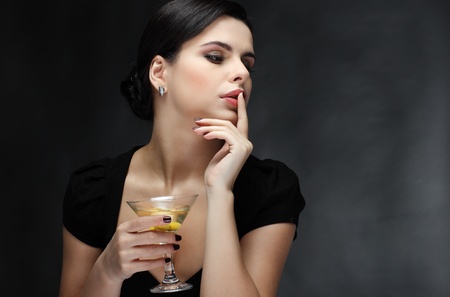 beautiful young girl  with  glass of martiniの写真素材
