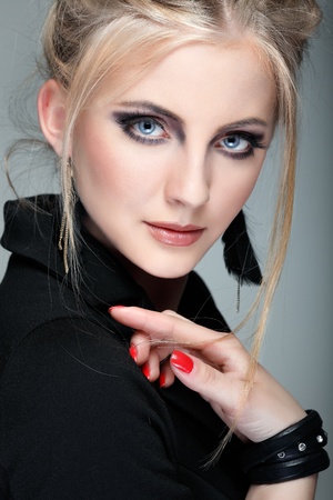 A photo of beautiful girl is in fashion style on  grey  background, glamourの写真素材