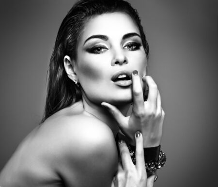 Closeup portrait of sexy  young woman with beautiful green eyes on white backgroundの写真素材