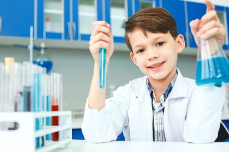 Little child with learning class in school laboratory preparationの写真素材