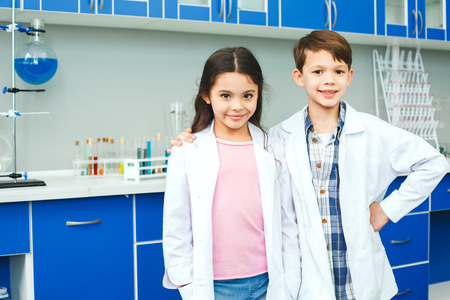 Little kids learning chemistry in school laboratory best friendsの写真素材