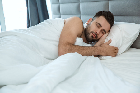 Bachelor man daily routine single lifestyle morning concept sleepの写真素材