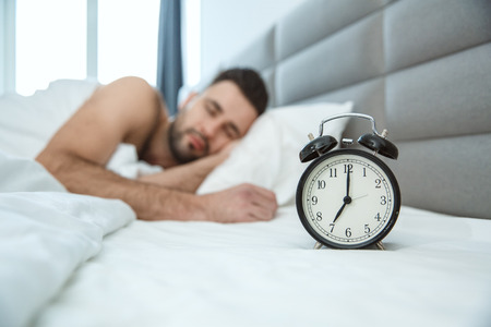 Bachelor man daily routine single lifestyle morning concept alarm clockの写真素材