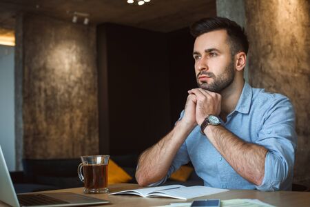 Bachelor man daily routine working from home single lifestyle concept concernedの写真素材