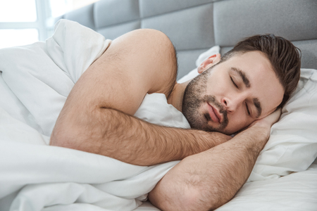 Bachelor man daily routine single lifestyle morning concept sleep close-upの写真素材