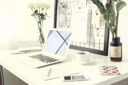 Freelancer working oblects laptop on the desk nobody side view close-upの写真素材
