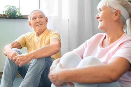 Senior couple exercise together at home health care restの写真素材