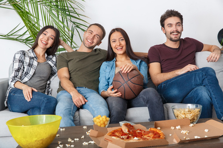 Group of friends sport fans watching basketball game time togetherの写真素材
