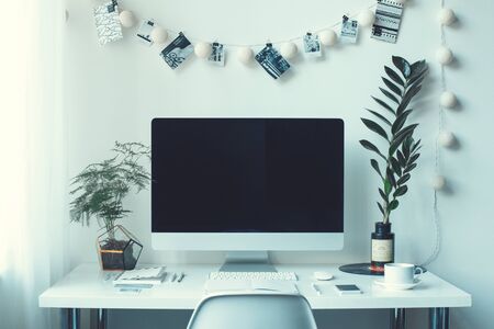 Freelance workspace computer on a desk no people front view close-upの写真素材