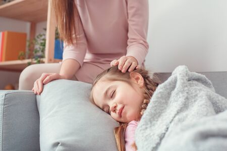 Mother and daughter weekend together at home girl sleepingの写真素材