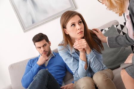 Young couple with psychologist family therapy hopeの写真素材