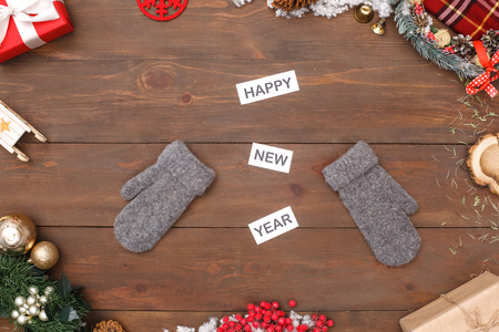 Happy New Year Congratulations. Mittens isolated on table top view close-upの写真素材