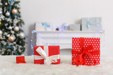 New Year. Decorated room no people different sized gifts on sofa close-up blurred bakgroundの写真素材
