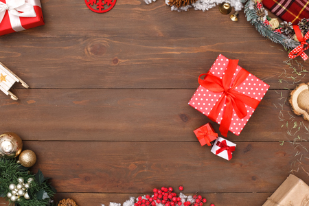 Merry Christmas. Different sized gifts isolated on wooden surface top view close-upの写真素材