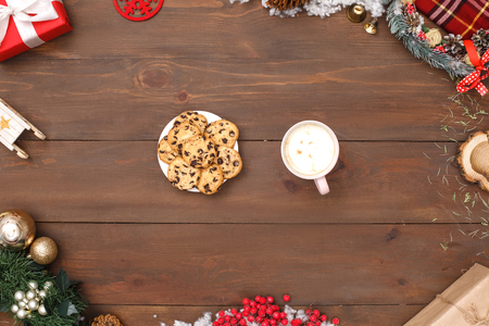 Merry Christmas. Plate of cookies and cup of coffee isolated on table top view close-upの写真素材