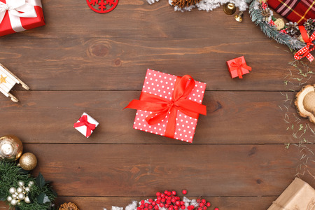 Merry Christmas. Different sized presents isolated on wooden surface top view close-upの写真素材