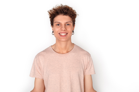 Teenager with earrings studio standing isolated on white smiling cheerfulの写真素材