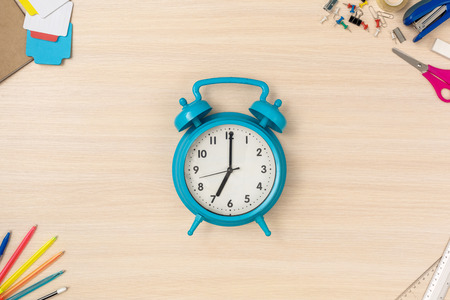 Time to Work. Desk top view no people alarm clock close-upの写真素材