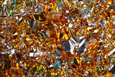 Golden christmas tinsel close-up isolated top viewの写真素材