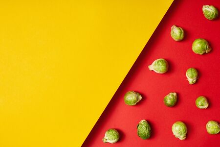 Brussels sprout isolated on yellow and red background healthy eating copy space for text or productの写真素材