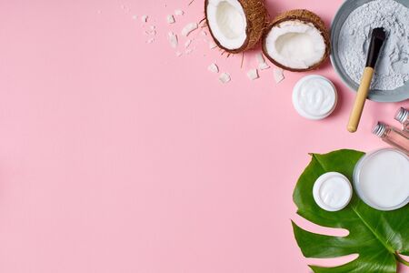 Coconut milk facial cream and body lotion isolated on pink background top view beauty careの写真素材