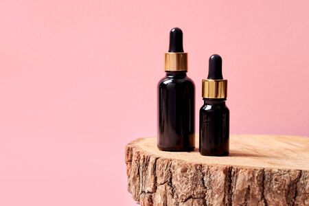 Beauty Care. Anti-aging hyaluronic acid isolated on pink close-up copy spaceの写真素材