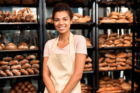Young adult female working in small family bakeryの写真素材