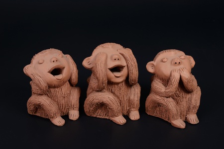 Three monkeys  One closed his ears, one closed his eyes and ontherone closed his mount  The general handicraft made by clay that can see alot from every country の写真素材