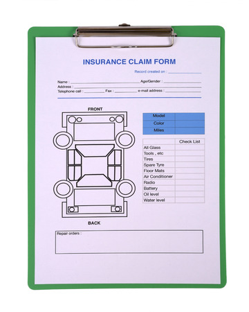 Blank insurance claim form on green clipboard の写真素材