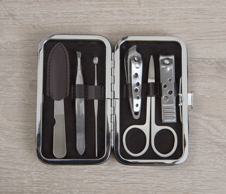Small set of healthy and beauty tools in box on wooden table.の写真素材
