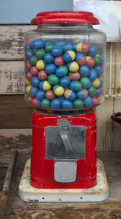 Bubble gum ball in rusty vending machine in retro style.の写真素材