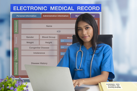 Female doctor working with patient blank form of electronic medicale record system on background.の写真素材
