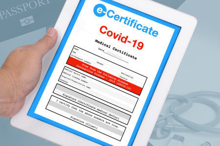 Hand holding electronic tablet showing e-certificate that whom freeの写真素材