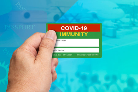 Hand holding  immune certification card.