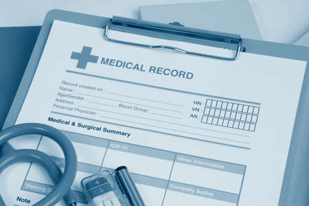 Close up blank medical record form on clipboard in monochrome.の写真素材