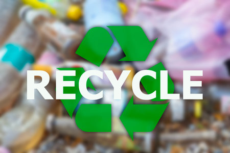 Recycle text and signs with high angle view of plastic and glass bottles piled up on the background.の写真素材