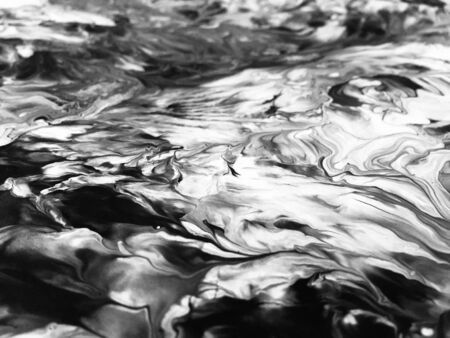 Close Up Black And White Colors Fluid Pouring Abstract Art Acrylic Painting Texture Backgroundの写真素材