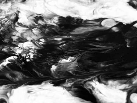 Close Up Black and White Colors Fluid Pouring Abstract Art Acrylic Painting Texture Backgroundの写真素材