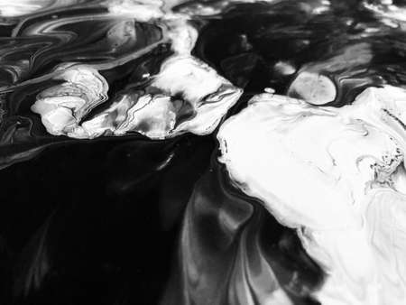 Close Up Black and White Colors Fluid Pouring Abstract Art Acrylic Painting Texture Backgroundの写真素材