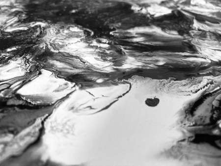 Close Up Black and White Colors Fluid Pouring Abstract Art Acrylic Painting Texture Backgroundの写真素材