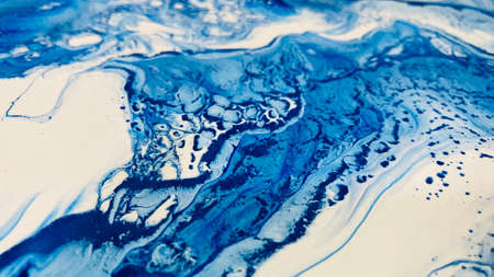 Close Up Colorful Blue and White Colors Fluid Pouring Abstract Art Acrylic Painting Texture Backgroundの写真素材