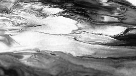Close Up Black and White Colors Fluid Pouring Abstract Art Acrylic Painting Texture Backgroundの写真素材