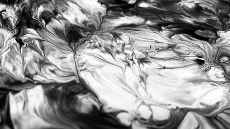 Close Up Black and White Colors Fluid Pouring Abstract Art Acrylic Painting Texture Backgroundの写真素材
