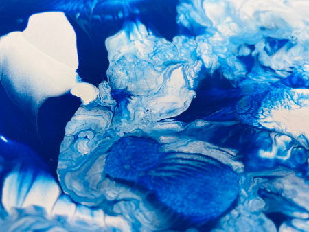 Close Up Colorful Blue and White Colos Fluid Pouring Abstract Art Acrylic Painting Texture Backgroundの写真素材